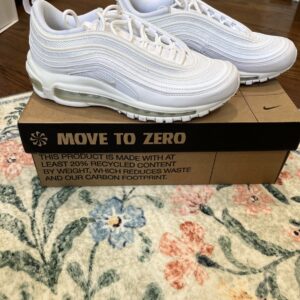 Nike Air Max 97 Triple White sneakers, which feature a ripple design